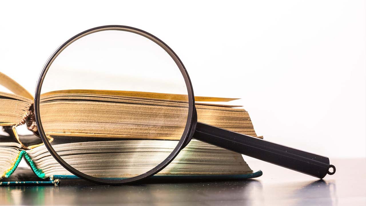 Books magnifying glass